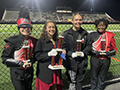  PM East HS band members hold awards won at 1st Flag over the United Colonies Band Festival. 